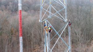 Workers put sections of the new microwave tower in Bedford together in December of 2024.