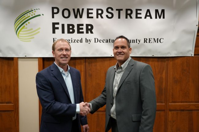 Tony Clark of SEI Communications and Brett Abplanalp of Decatur County REMC shake hands at the launch of PowerStream Fiber on January 17, 2025.